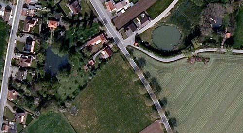 The three craters that remain today. The fourth was on the road on the left, presumably filled in when the road was repaired.